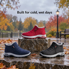Sianna boots in red, navy and black on a wet stone ledge