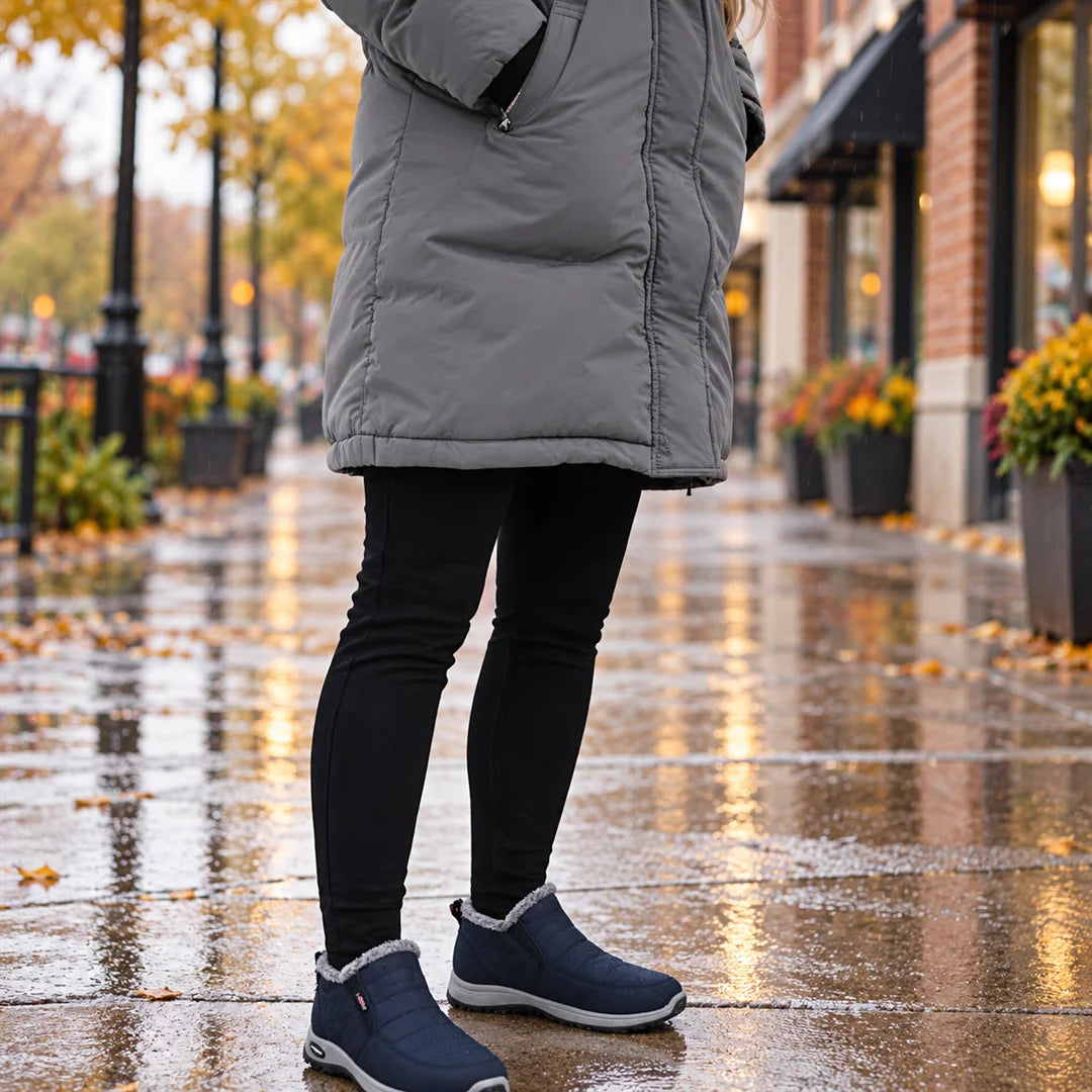 Sianna boots worn on a wet sidewalk